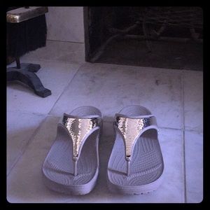 Women's gold CROCS sandals